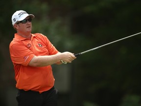 Brad Fritsch of Canada plays his tee shot on the eighth hole during the third round of the Wyndham Championship at Sedgefield Country Club on August 16, 2014 in Greensboro, North Carolina.  Darren Carroll/Getty Images/AFP