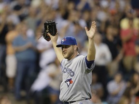 Mark Buehrle of the Toronto Blue Jays reacts after after being removed from the game against the Chicago White Sox in the sixth inning at U.S. Cellular Field on August 16, 2014. (Jeffrey Phelps/Getty Images/AFP)