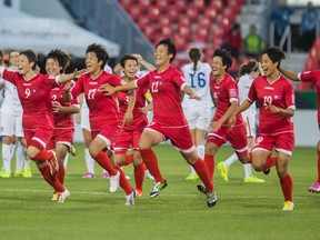 North Korean players celebrate their victory over the United States during their under-20 quarterfinal match last night. (Ernest Doroszuk/Toronto Sun)