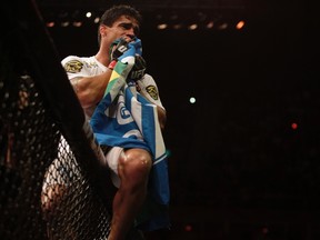 Thiago Tavares of Brazil celebrates after defeating Sam Stout of Canada (not pictured) during their UFC bout in Rio de Janeiro on January 14, 2012. (REUTERS/Ricardo Moraes)