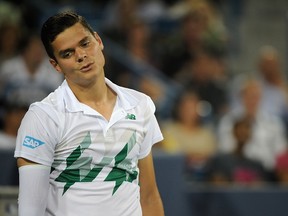 Milos Raonic of Canada reacts during a match against Roger Federer of Switzerland at the Western & Southern Open at the Linder Family Tennis Center on August 16, 2014. (Jonathan Moore/Getty Images/AFP)