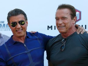 Cast members Sylvester Stallone and Arnold Schwarzenegger pose during a photocall on the Croisette to promote the film "The Expendables 3" during the 67th Cannes Film Festival in Cannes May 18, 2014.          REUTERS/Yves Herman