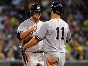 New York Yankees catcher Brian McCann (34) is congratulated by left fielder Brett Gardner (11) after scoring a run during the fourth inning against the Boston Red Sox at Fenway Park earlier this month. (Bob DeChiara-USA TODAY Sports)