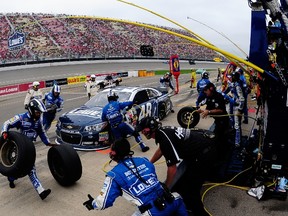 Jimmie Johnson pits during the Pure Michigan 400 at Michigan International Speedway on Sunday. Johnson finished 10th. (AFP/PHOTO)