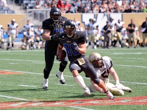 Winnipeg Rifles receiver Kurt Goodrich rambles for the Rifles only touchdown in a 25-15 loss to the Edmonton Huskies in Prairie Football Conference action, Sunday, August 17, 2014, at the Investors Group Field in Winnipeg. Photo by Matthew Hamilton