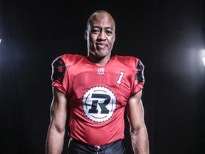 QB Henry Burris shows off the third jersey and helmet being unveiled today by the Ottawa RedBlacks. (Submitted image)