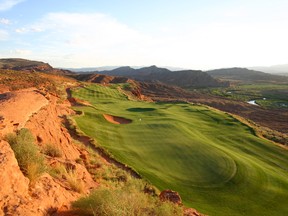 Outcroppings of red rock accent the 13th hole at scenic Sand Hollow, one of many excellent golf courses in Mesquite, Nev. (Handout)