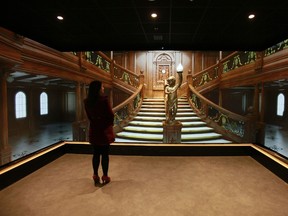 A changing electronic display is seen of main staircase aboard the Titanic in the 'The Fit Out' gallery at the Titanic visitor centre in Belfast, Northern Ireland.  AFP PHOTO/PETER MUHLY