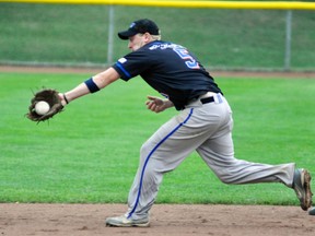 Second baseman Scott Lealess of the Mitchell Mets ranges to his right to make this dandy defensive play at the ISC World Championships in Kitchener. Lealess also hit a pair of home runs in the team's two wins Aug. 11. ANDY BADER/MITCHELL ADVOCATE