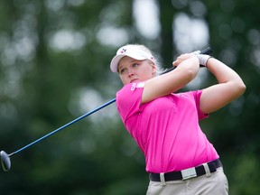 Sixteen year old amateur Brooke Henderson unleashes a drive off the fourteenth tee at FireRock (cct) Golf Club on day two of the PGA Women's Championship of Canada in Komoka, Ontario on Wednesday, July 30, 2014.(DEREK RUTTAN/ The London Free Press /QMI AGENCY)