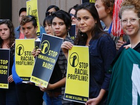 Migrant justice group No One Is Illegal protests the Ontario government for racial profiling Monday, August 18, 2014. (Stan Behal/Toronto Sun)