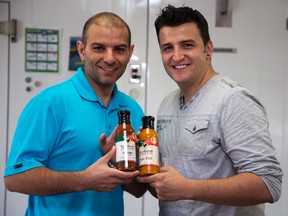 Andre Almeida, left, and Ricardo Cavaco operate Cavameida, a London company that produces three types of low-sugar, low-salt Portuguese sauce. The pair plan to launch more gourmet products. (DEREK RUTTAN, The London Free Press)