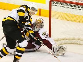 Peterborough Petes' goalie Andrew D'Agostini is caught out of position seconds before Kingston Frontenacs' Lawson Crouse scores during second period OHL action in March at the Memorial Centre in Peterborough. CLIFFORD SKARSTEDT/QMI Agency