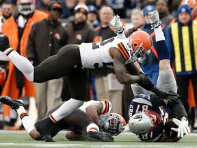Patriots tight end Rob Gronkowski tore his ACL on this hit by the Browns’ T.J. Ward (right) and D’Qwell Jackson last year. (USA TODAY SPORTS)