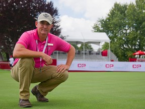 Hunt Club? course supervisor Jayson Griffiths gets up close and personal with the totally new 17th green, which had to be rebuilt after winter kill virtually wiped out the grass. Griffiths says the course is in great condition. (MIKE HENSEN, The London Free Press)