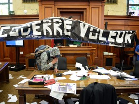 In a protest against proposed changes to pensions, angry fire fighters broke into City Hall Monday night and vandalized several rooms, including the council chambers.
(MAXIME DELAND / QMI AGENCY)