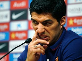 FC Barcelona's Luis Suarez gestures during a news conference at the Nou Camp stadium in Barcelona August 19, 2014. (REUTERS)
