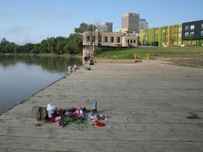 A makeshift shrine to Tina Fontaine sits at the Alexander Docks, near where her body was retrieved from the river on Sunday. (KRISTIN ANNABLE/WINNIPEG SUN PHOTO)