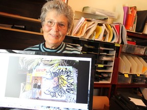 Judy Sieffert with an image of friends, a young man who now owns a hostel, and his girlfriend from a village in Nicaragua where the Glencoe resident volunteers every year. She is collecting eReaders for a local library.  ELENA MAYSTRUK/ AGE DISPATCH/ QMI AGENCY