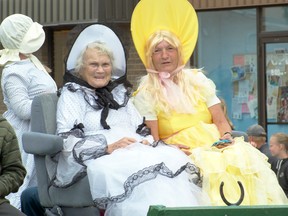 Beautiful outfits on two beautiful models atop the Vista Village float. Greg Cowan photo/QMI Agency.