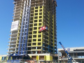 A Grill Master Express food truck was raised atop the 21-storey Rideau condo beside TD Place on Tuesday, Aug. 19, 2014. It was a part of a "topping off" lunch for workers. (JON WILLING/Ottawa Sun/QMI Agency)