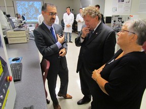 Professor Shahram Karimi, left, leads Ed Holder, federal minister of state for science and technology, and Sarnia-Lambton MP Pat Davidson, on a tour Tuesday of Lambton College's alternative energy lab. Federal funding announced back in April allowed the college to purchase equipment for several research projects. (PAUL MORDEN/ THE OBSERVER/ QMI AGENCY)