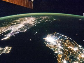North Korea (the dark area) and South Korea at night are seen in an undated NASA handout picture from the International Space Station. (REUTERS/NASA/Handout via Reuters)