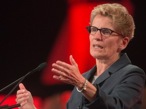 Ontario Premier Kathleen Wynne addresses delegates at the annual general meeting of the Association of Municipalities Ontario at the London Convention Centre in London Ontario on Tuesday, August 19, 2014. (DEREK RUTTAN, The London Free Press)