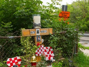 A memorial set up for Mate Magdic who fell from Blackfriars Bridge during construction in 2013. (MIKE HENSEN, The London Free Press)
