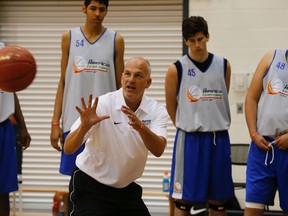 Team Canada coach Jay Triano gets set to catch a pass during the Americas team camp at the Mattamy Athletic Centre. (Stan Behal/Toronto Sun)
