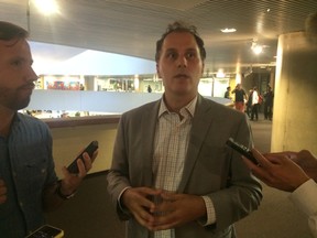Councillor Josh Colle speaks to reporters at City Hall on Tuesday, Aug. 19, 2014. (Don Peat/Toronto Sun)