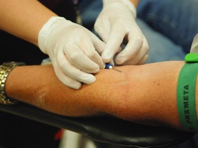 A needle-phobe will give blood for $1,500 as part of the Canadian Cancer Society's Fearless Challenge.