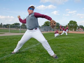London Badgers peewee third baseman Nick Brooks warms up with his teammates at a practice at Stronach Park in London, Ontario on Monday August 18, 2014. (CRAIG GLOVER, The London Free Press)