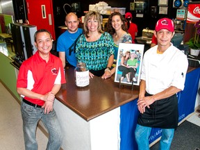 Gerald Titong and Ronnie Zabala (front) were joined by Dustin, Joanne and Kristen Belke at Whitecourt’s Hearty Fusion Express to pay tribute to “Momma Ann” by donating Aug. 13’s sales to the Alzheimer’s Society. Bryan Passifiume photo | Whitecourt Star
