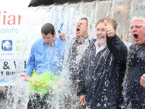 Gino Donato/The Sudbury Star  
Reliance Home Comfort employees, Brian Bonora, Kelly DeGurse, Dale MacCormack and Kevin Macey, get drenched in ice and water while taking part in the ALS Ice Bucket Challenge in this file photo.
