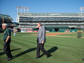 Oakland Athletics owner Lew Wolff (left) and MLB commissioner Bud Selig (right) leave the field before the game against the New York Mets at O.co Coliseum. (Kyle Terada-USA TODAY Sports)