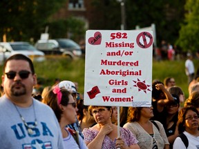 Hundreds of Manitobans attended a vigil at Alexander Docks in Winnipeg, Man., on Tues., Aug. 16, 2014 to honour the memory of two aboriginal people. The bodies of Tina Fontaine and Faron Hall were found in two separate recoveries on Sun., Aug. 17, 2014. (Brook Jones/QMI Agency File)
