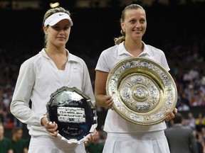 Eugenie Bouchard (L) of Canada holds the runner up trophy after being defeated by Petra Kvitova (R) of Czech Republic, holding the winner's trophy, the Venus Rosewater Dish, at their women's singles final tennis match at the Wimbledon Tennis Championships in London July 5, 2014. (REUTERS)
