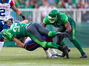 John Chick of the Saskatchewan Roughriders sacks Alex Brink  of the Montreal Alouettes August 16, 2014.