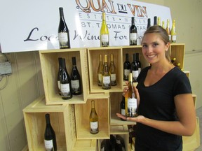 Beth Pfeffer, with Quai du Vin winery near Sparta, has been looking after the winery's booth Wednesdays at the Sarnia Farmers Market this summer. It has been selling wine there this summer under a provincial pilot project. PAUL MORDEN/ THE OBSERVER/ QMI AGENCY