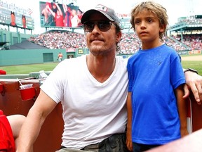 Matthew McConaughey, seen with his son at a Boston Red Sox game on Aug. 17, says he's "not afraid of the fanny pack."