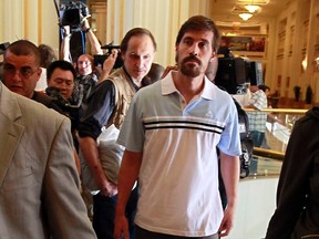 U.S. journalist James Foley (R) arrives with fellow reporter Clare Gillis (not pictured), after being released by the Libyan government, at Rixos hotel in Tripoli, in this picture taken May 18, 2011. (REUTERS/Louafi Larbi)