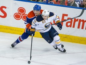 Sabres centre Tyler Ennis, shown here tangling with Taylor Hall at Rexall Place last season, says coach Ted Nolan has been able to raise the level of play on the team. (USA TODAY)