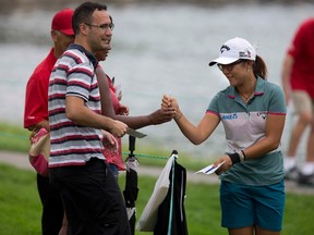 Lydia Ko signs autographs during the pro-am event at the 2014 CP Women's Open at the London Hunt and Country Club in London Ontario on Wednesday, August 20, 2014. (DEREK RUTTAN, The London Free Press)