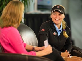 Canadian golfer Brooke Henderson (right) is interviewed in the media tent during the Pro Am event at the 2014 CP Women's Open at the London Hunt and Country Club in London, Ont. on Wednesday. (Derek Ruttan/QMI Agency)