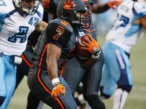 Tim Brown carries the ball as the B.C. Lions take an early lead in the first half against the Toronto Argonauts at the Rogers Centre  during CFL action in Toronto, Ont. on Sunday August 17, 2014. Stan Behal/Toronto Sun/QMI Agency