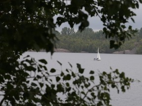 Gino Donato/The Sudbury Star
A Sudbury Yacht Club sailing school sailboat makes its way across Lake Ramsey on Thursday in light drizzle. The forecast for today calls for mainly cloudy skies with  40 percent chance of showers in the morning and early in the afternoon and a high of 21.