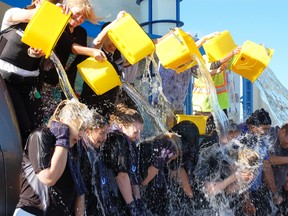 People take part in the ice-bucket challenge. (QMI Agency file photo)
