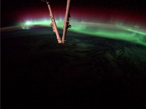 An aurora dances in the atmosphere on Aug. 20, 2014, as the International Space Station flew over North America. This image was captured by astronaut Reid Wiseman from his vantage point on the ISS. (Photo: NASA/Handout/QMI Agency)