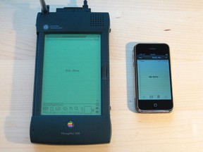 The Apple Newton MessagePad 2100 (left) is pictured with an iPhone. (Blake Patterson/Wikimedia Commons/HO)